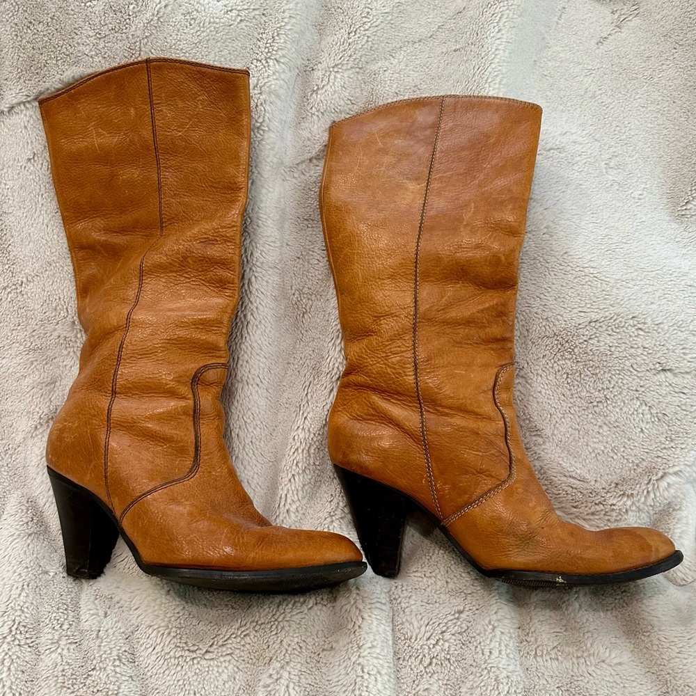 Leather, calf length woman’s boots